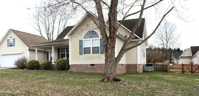 view of front of house with a garage and a front lawn