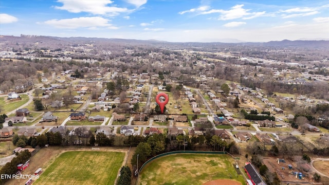 birds eye view of property featuring a mountain view