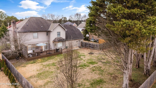 back of property featuring a wooden deck