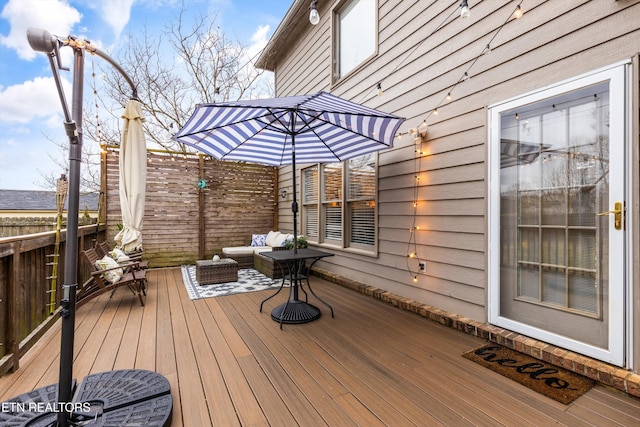 wooden deck with an outdoor hangout area