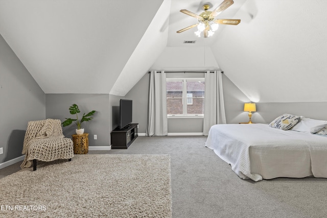 carpeted bedroom featuring ceiling fan and vaulted ceiling