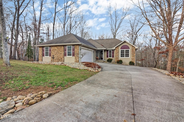 ranch-style home featuring a front yard and a garage