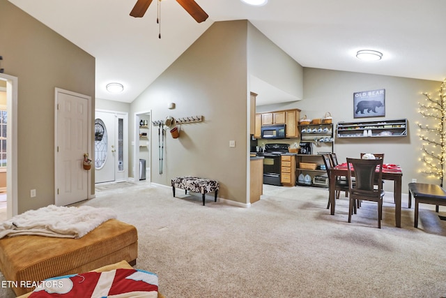 living room with ceiling fan, light colored carpet, and vaulted ceiling