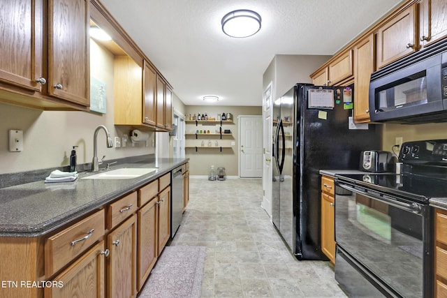 kitchen with sink and black appliances