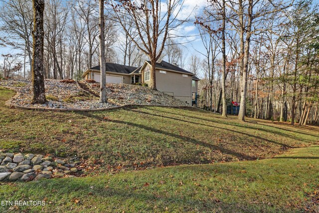 view of yard with a garage