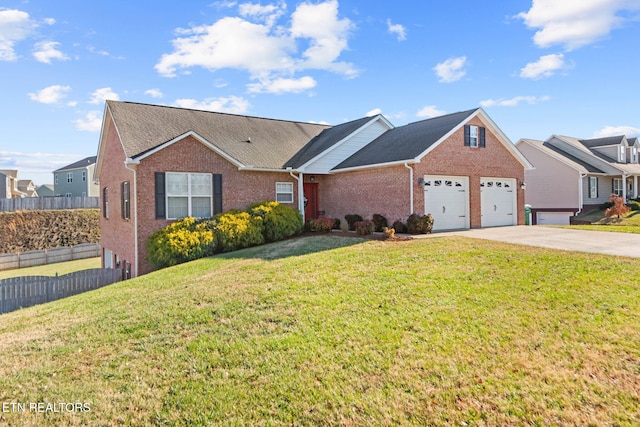 view of front facade with a front yard and a garage