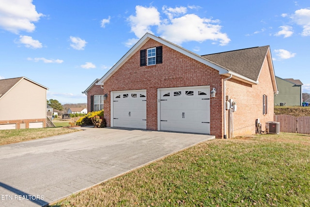 view of home's exterior with central AC unit, a garage, and a lawn