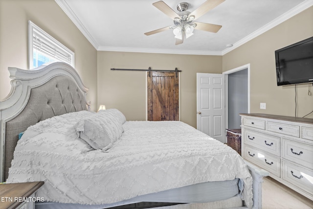 bedroom featuring ceiling fan, a barn door, and ornamental molding