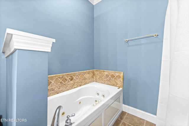 bathroom with tile patterned flooring, a bathtub, and crown molding