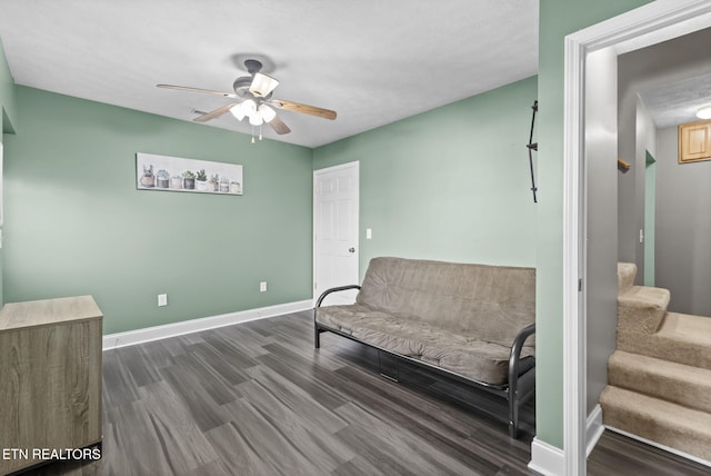 sitting room featuring ceiling fan and dark hardwood / wood-style floors