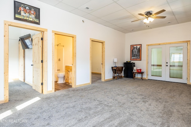 interior space with french doors, a paneled ceiling, and ceiling fan