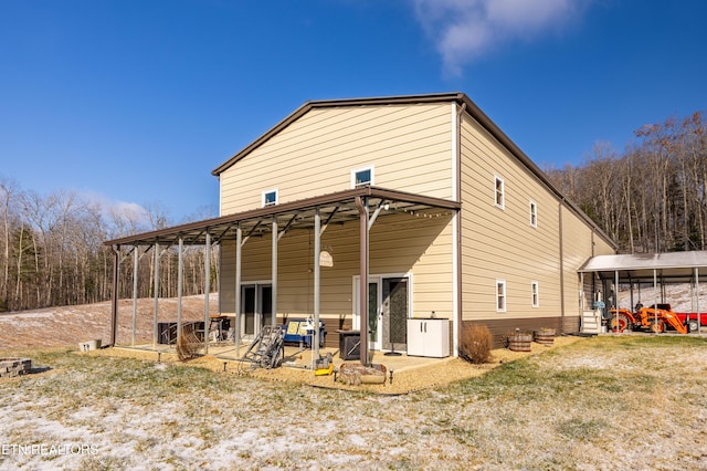 rear view of house with a yard