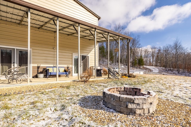 exterior space with an outdoor fire pit