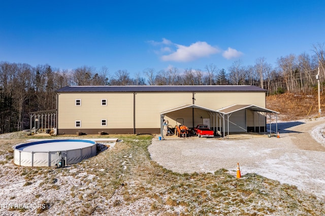 view of outbuilding featuring a carport