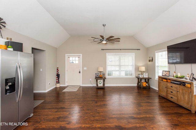 kitchen featuring ceiling fan, lofted ceiling, stainless steel refrigerator with ice dispenser, and dark wood-type flooring