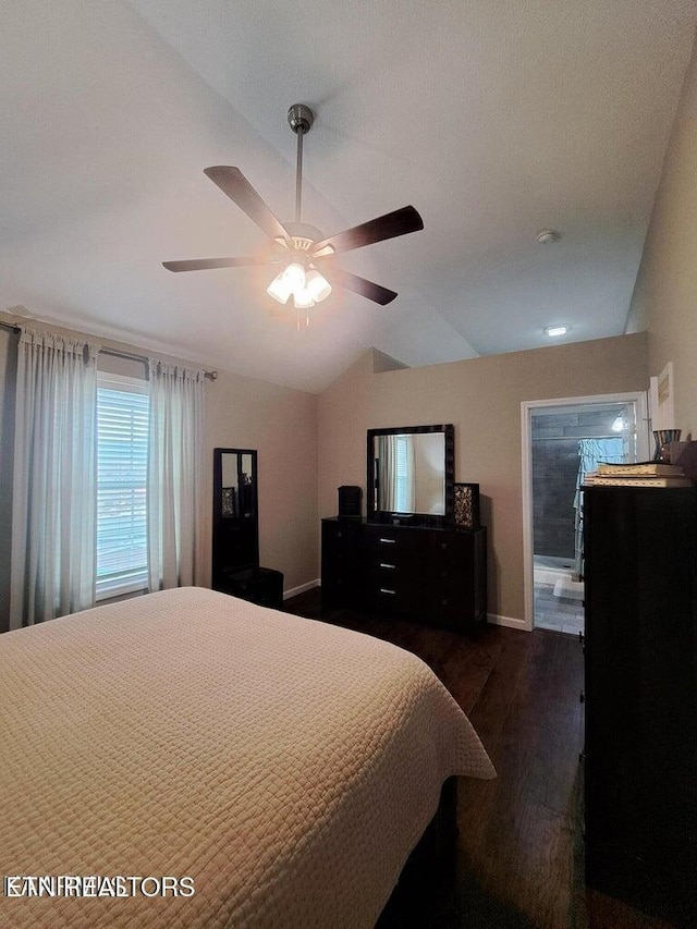 bedroom featuring ceiling fan, dark wood-type flooring, and vaulted ceiling