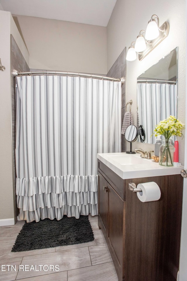 bathroom featuring hardwood / wood-style flooring and vanity