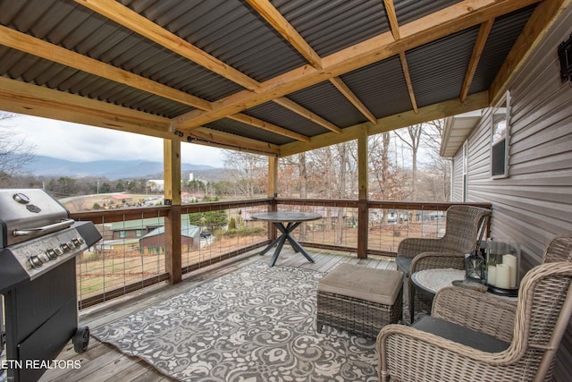 sunroom featuring a mountain view