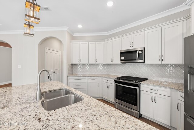 kitchen with white cabinetry, sink, and appliances with stainless steel finishes