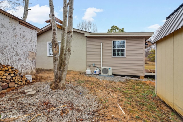 view of side of property featuring ac unit