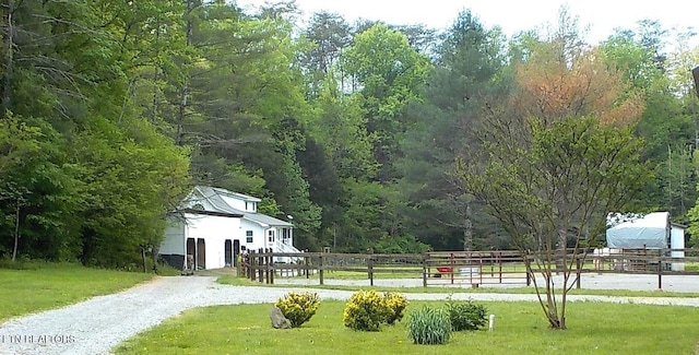 view of property's community with a lawn