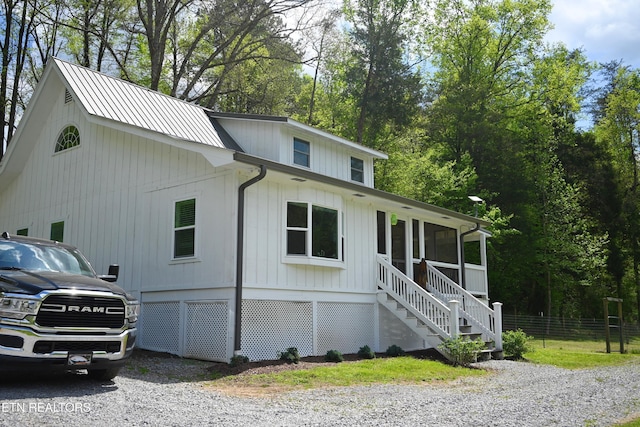 view of home's exterior featuring a sunroom