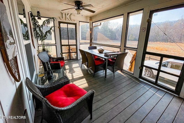 sunroom / solarium with ceiling fan