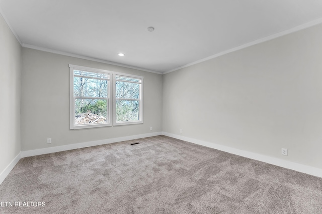 unfurnished room featuring carpet floors and ornamental molding