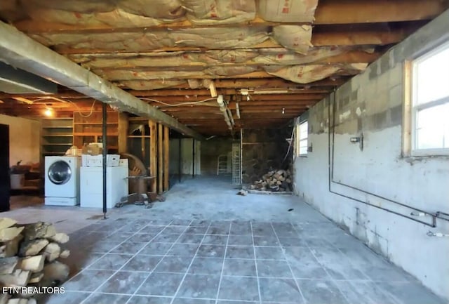 basement with washer and clothes dryer