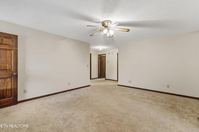3865 Ballplay Rd, Tellico Plains, TN 37385 - empty room featuring ceiling fan, light carpet, and a textured ceiling