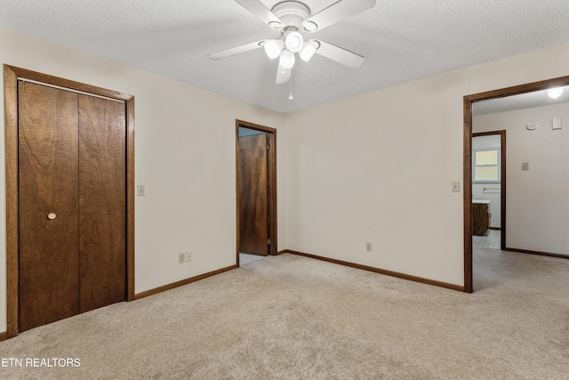 3865 Ballplay Rd, Tellico Plains, TN 37385 - unfurnished bedroom with ceiling fan, light colored carpet, and a textured ceiling