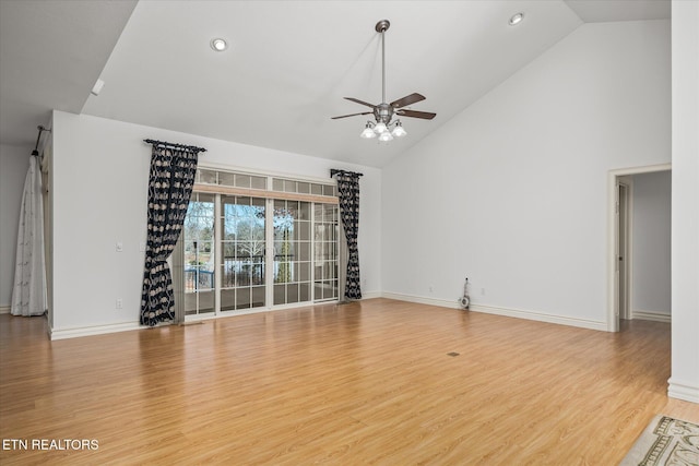 unfurnished living room featuring hardwood / wood-style floors, high vaulted ceiling, and ceiling fan