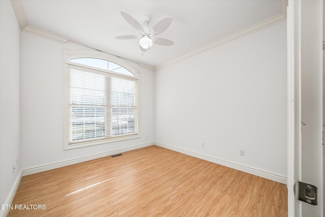 spare room featuring ceiling fan, wood-type flooring, and ornamental molding