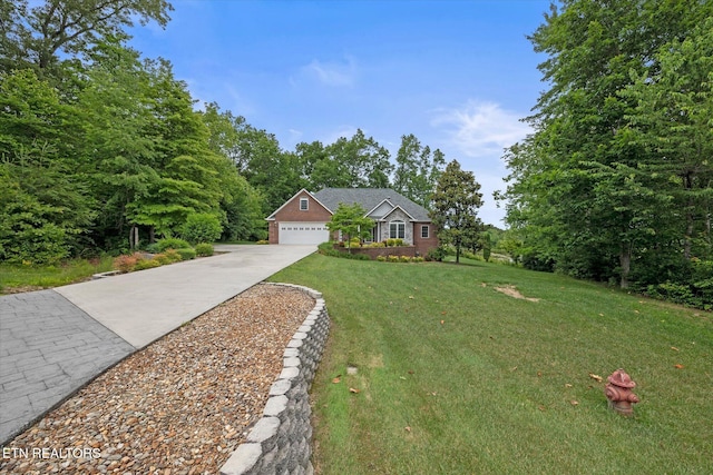 ranch-style home with a garage and a front lawn