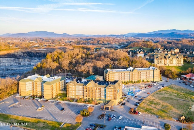 birds eye view of property featuring a mountain view