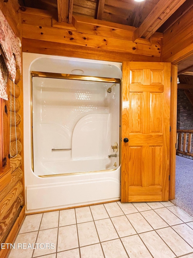 bathroom with bathtub / shower combination, beam ceiling, tile patterned floors, and wood walls