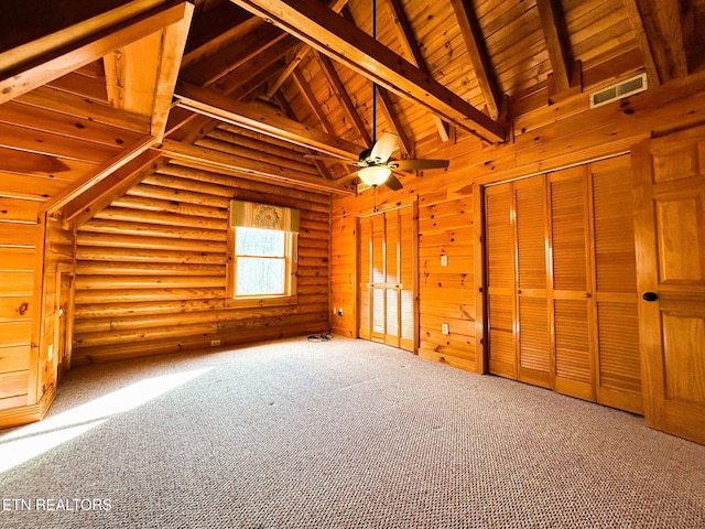 bonus room featuring ceiling fan, log walls, beamed ceiling, carpet, and wood ceiling