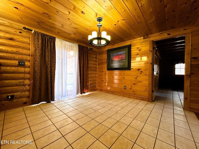 empty room with a chandelier, log walls, and wood ceiling