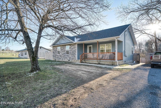 view of front of home featuring a front yard and a porch