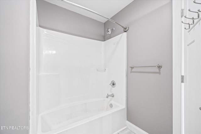 bathroom featuring washtub / shower combination