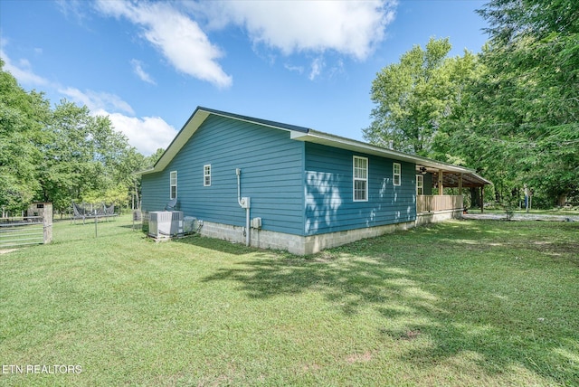 view of home's exterior featuring a lawn and cooling unit