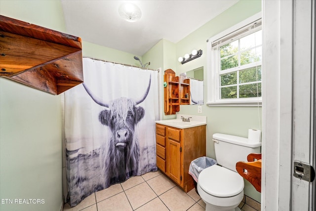 bathroom with a shower with curtain, tile patterned flooring, vanity, and toilet