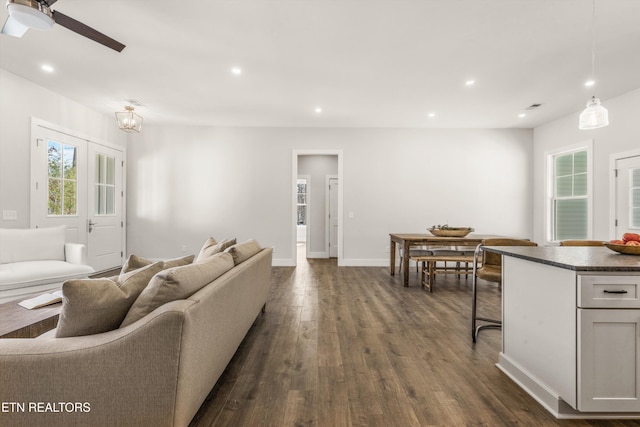 living area with french doors, dark wood finished floors, recessed lighting, a ceiling fan, and baseboards