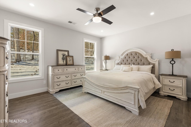 bedroom featuring baseboards, visible vents, dark wood finished floors, and recessed lighting