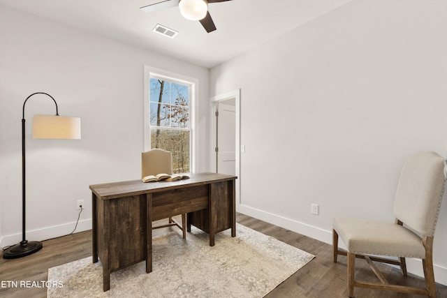 office with wood-type flooring and ceiling fan