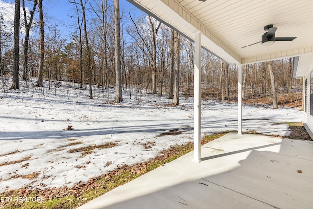 yard layered in snow with ceiling fan