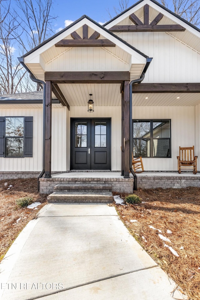 property entrance with french doors and covered porch