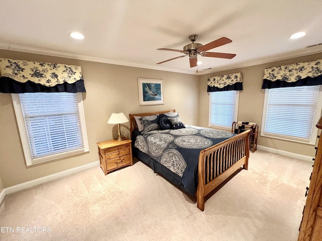 carpeted bedroom featuring ceiling fan and ornamental molding