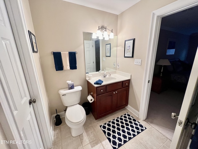 bathroom with tile patterned floors, vanity, and toilet