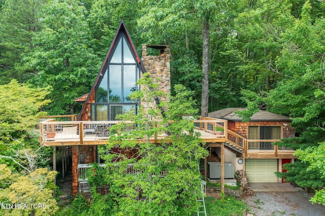 exterior space featuring a garage and a deck